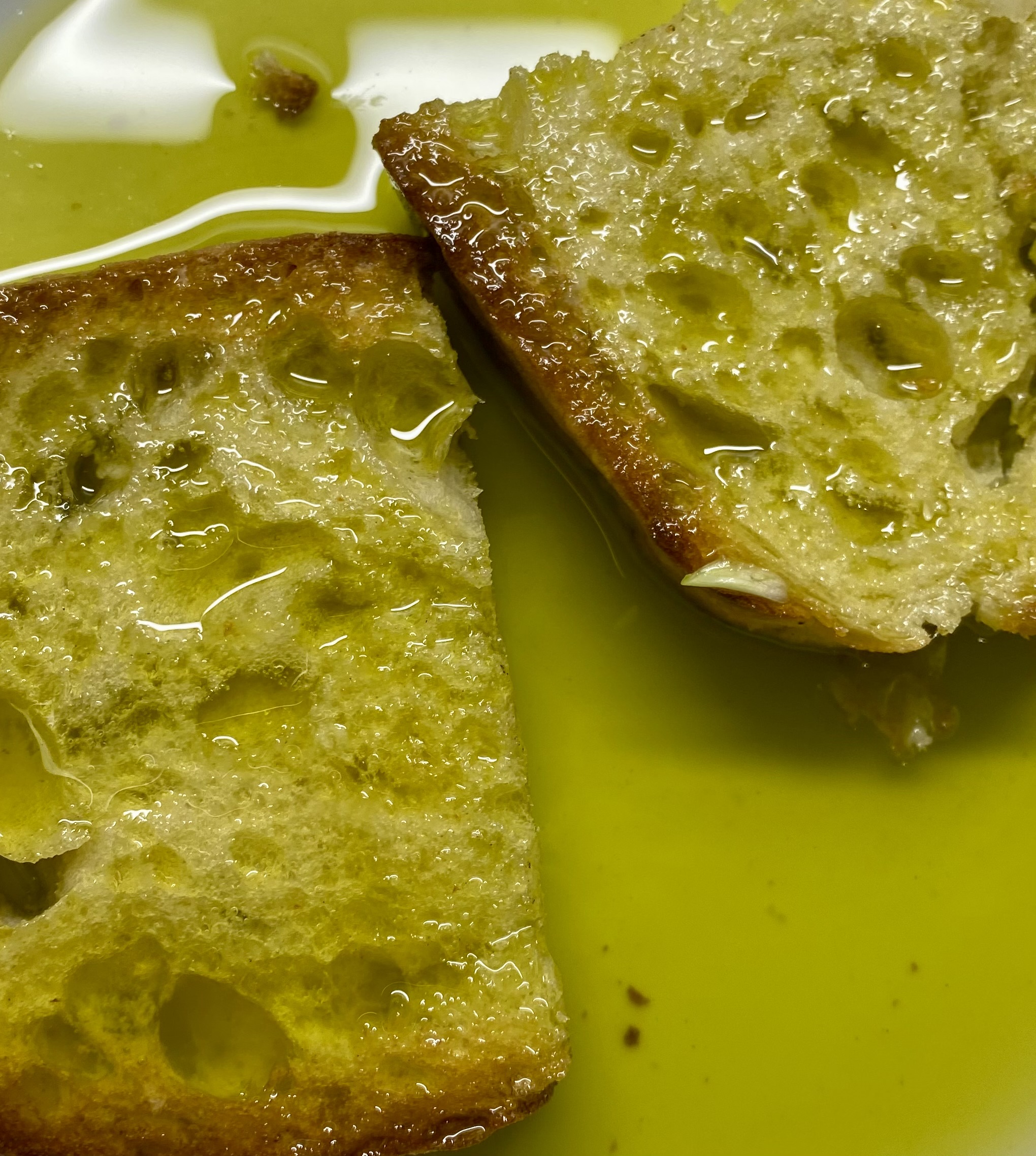 Bread drizzled with fresh olive oil