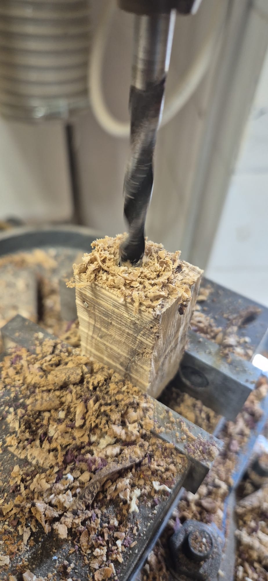 Drilling an olive wood block to insert the brass tube